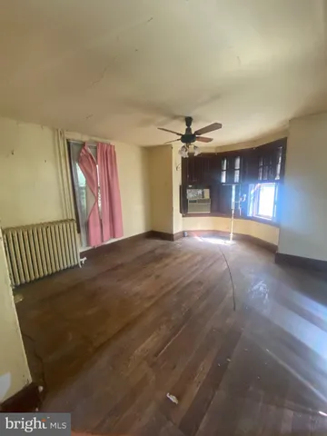 a view of an empty room and window