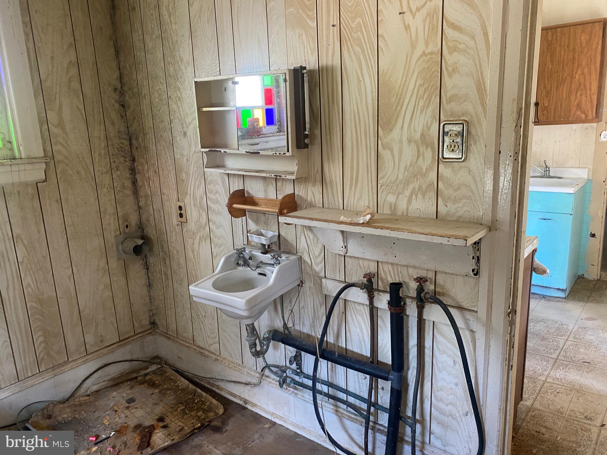 6704 Chestnut Street Port Norris, NJ 08349 - Photo 40 of 44 a bathroom with a sink and a mirror