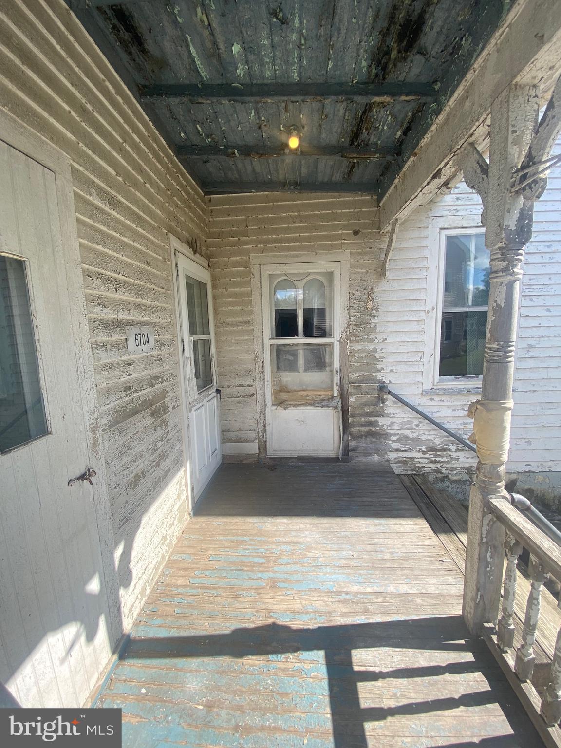 6704 Chestnut Street Port Norris, NJ 08349 - Photo 5 of 44 a view of entrance gate of the house