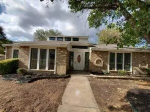 front view of a house with a yard