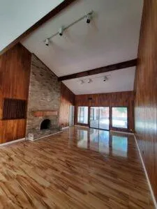 a view of a hallway with wooden floor
