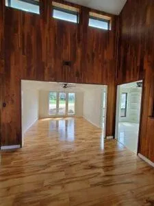 a view of a hallway with wooden floor