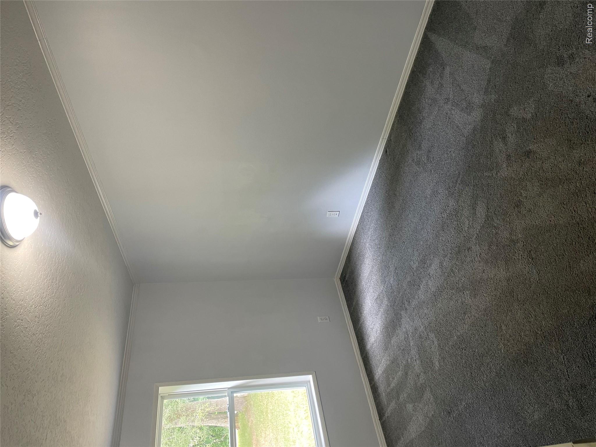1938 Indian Road Lapeer, MI 48446 - Photo 14 of 19 Neutral wall color, wall-to-wall carpeting, and a flush mount ceiling light fixture