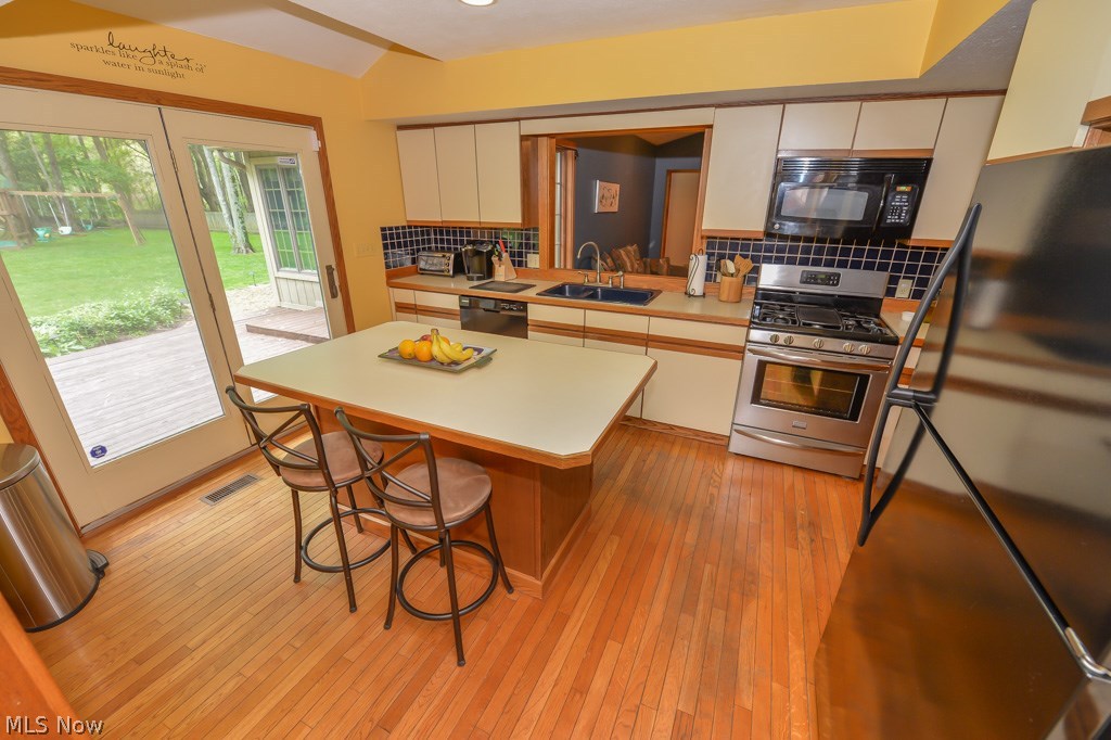 3200 Sandy Lake Road Ravenna, OH 44266 - Photo 12 of 31 Kitchen also has French doors to the deck and a pass thru to the family room.