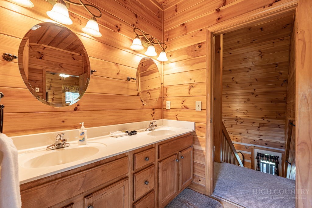 197 Woodby Ridge Road Vilas, NC 28692 - Photo 28 of 45 a bathroom with a sink and a mirror