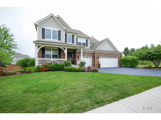 3038 Range Road Elgin, IL 60124 - Photo 1 of 10 a front view of a house with a yard