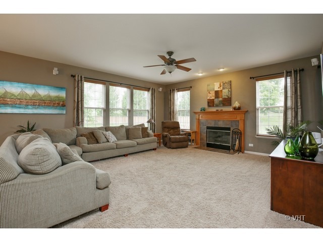 3038 Range Road Elgin, IL 60124 - Photo 5 of 10 a living room with furniture and a fireplace