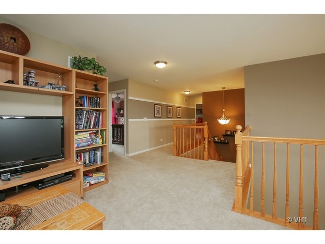 3038 Range Road Elgin, IL 60124 - Photo 7 of 10 a view of a livingroom with furniture and a flat screen tv