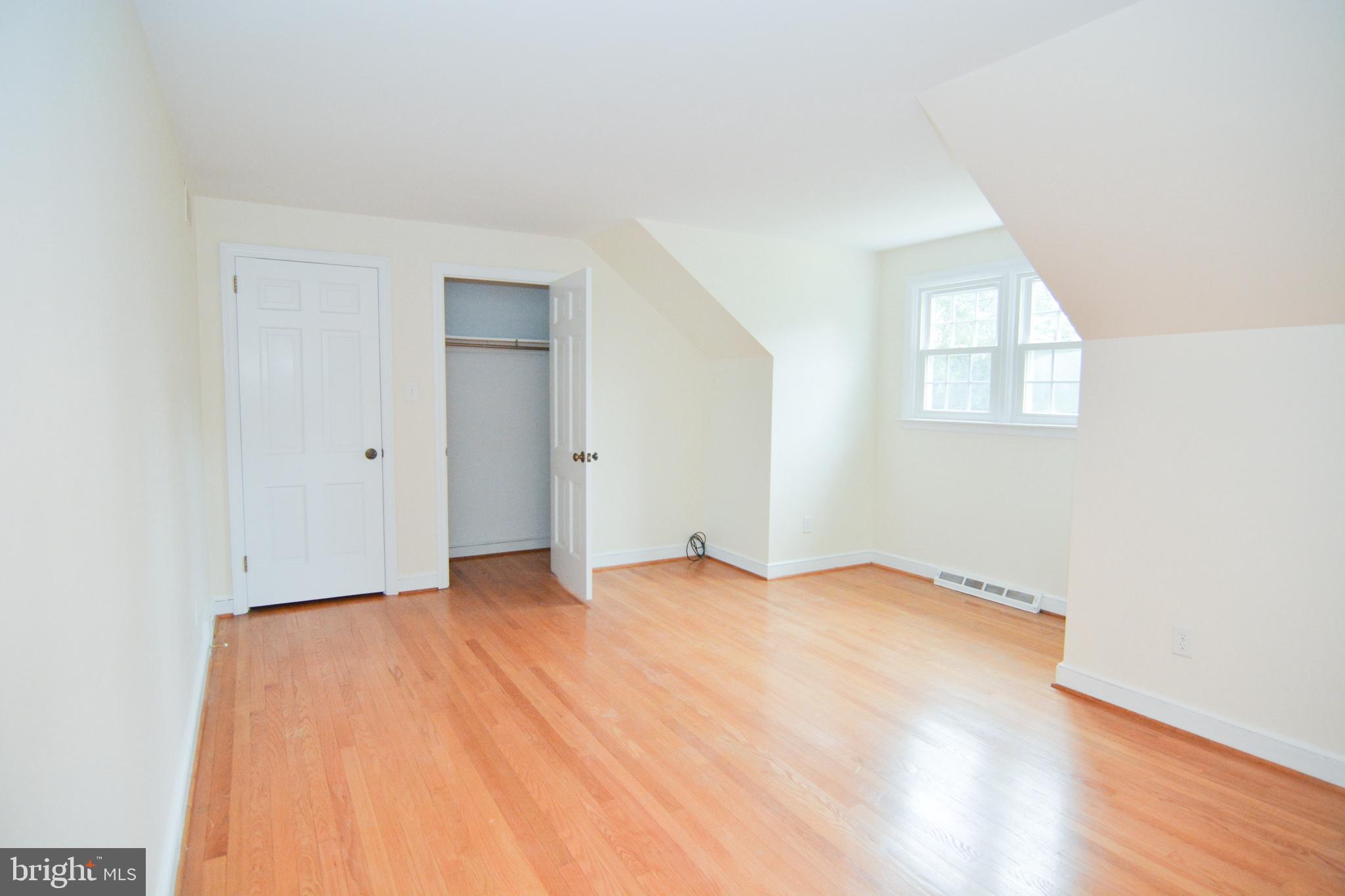 404 Snuff Mill Road Wilmington, DE 19807 - Photo 29 of 49 Large bedroom w/ hard floor floors and closet.