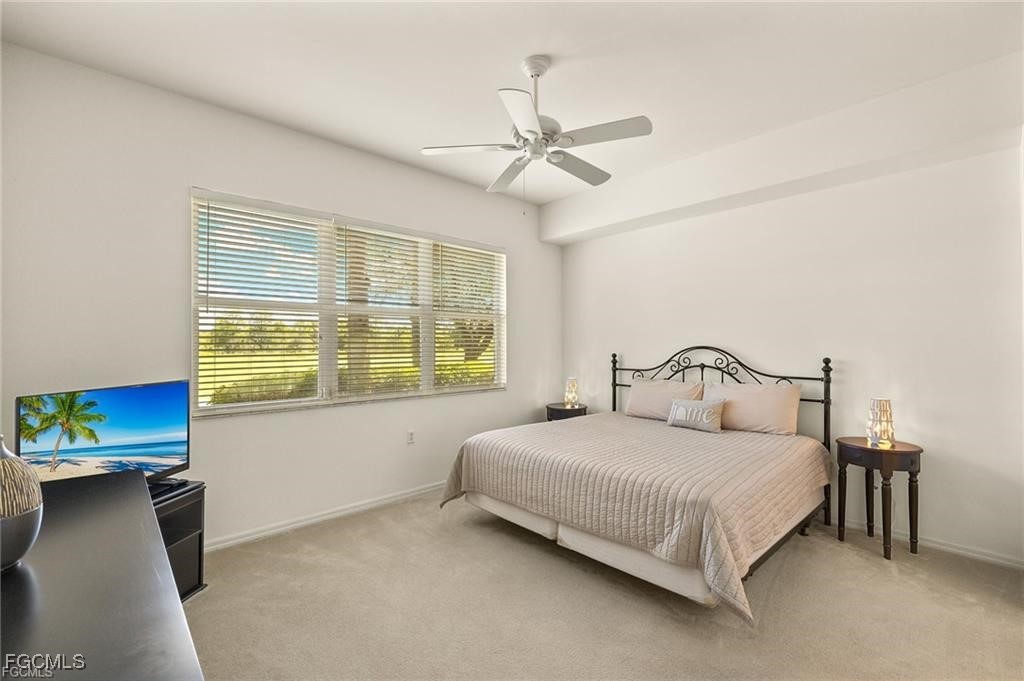 12120 Summergate Circle, Unit 103 Fort Myers, FL 33913 - Photo 11 of 26 a bedroom with a bed and window