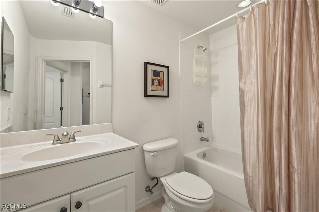 12120 Summergate Circle, Unit 103 Fort Myers, FL 33913 - Photo 17 of 26 a bathroom with a toilet a sink and a bathtub