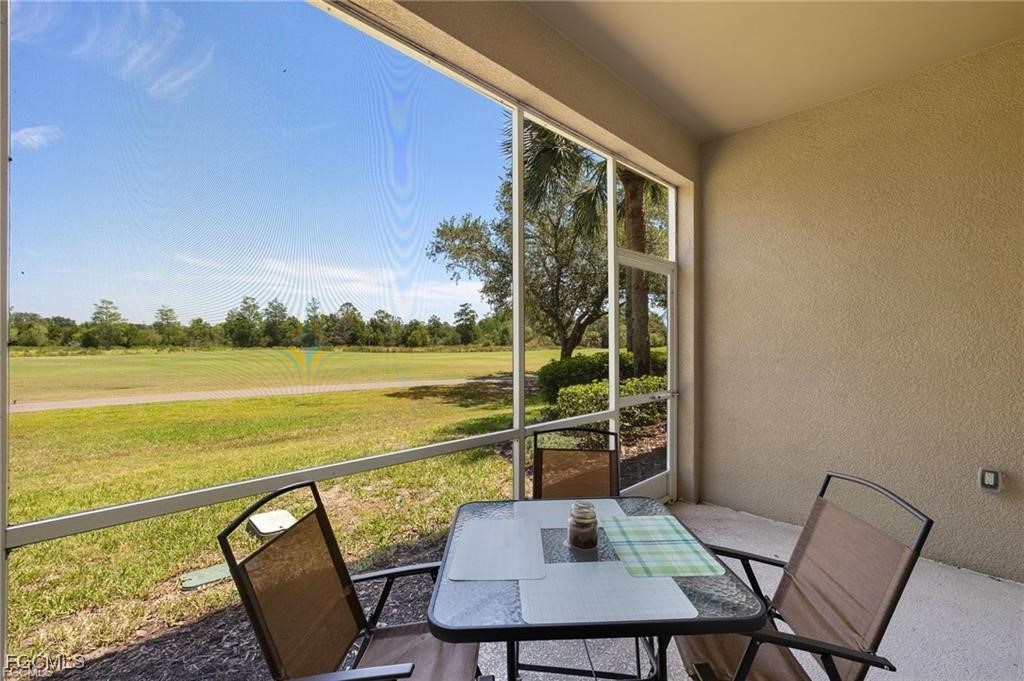 12120 Summergate Circle, Unit 103 Fort Myers, FL 33913 - Photo 18 of 26 a balcony with table and chairs