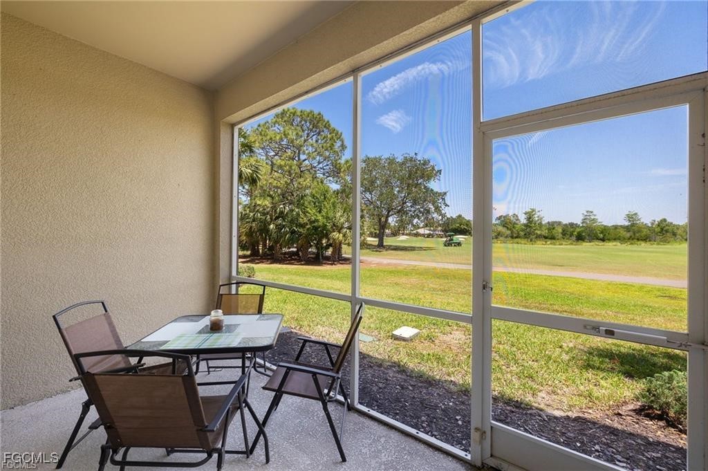 12120 Summergate Circle, Unit 103 Fort Myers, FL 33913 - Photo 19 of 26 a view of a city from a dining room with large windows