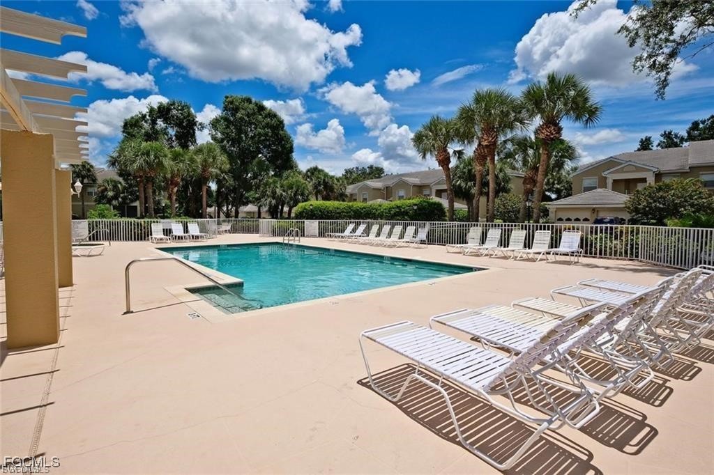 12120 Summergate Circle, Unit 103 Fort Myers, FL 33913 - Photo 20 of 26 a view of a swimming pool with a patio