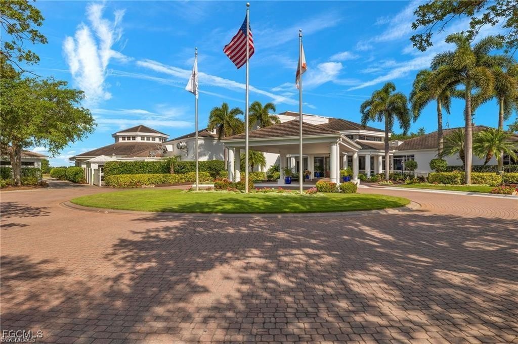 12120 Summergate Circle, Unit 103 Fort Myers, FL 33913 - Photo 24 of 26 a view of a house with a big yard