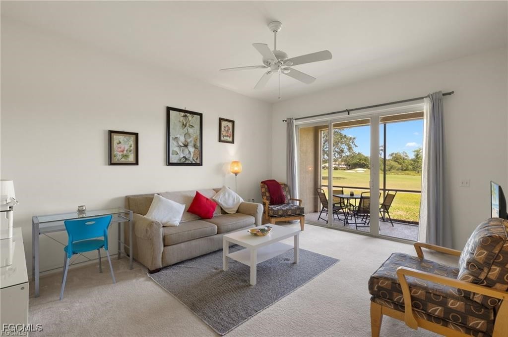12120 Summergate Circle, Unit 103 Fort Myers, FL 33913 - Photo 4 of 26 a living room with furniture and a large window