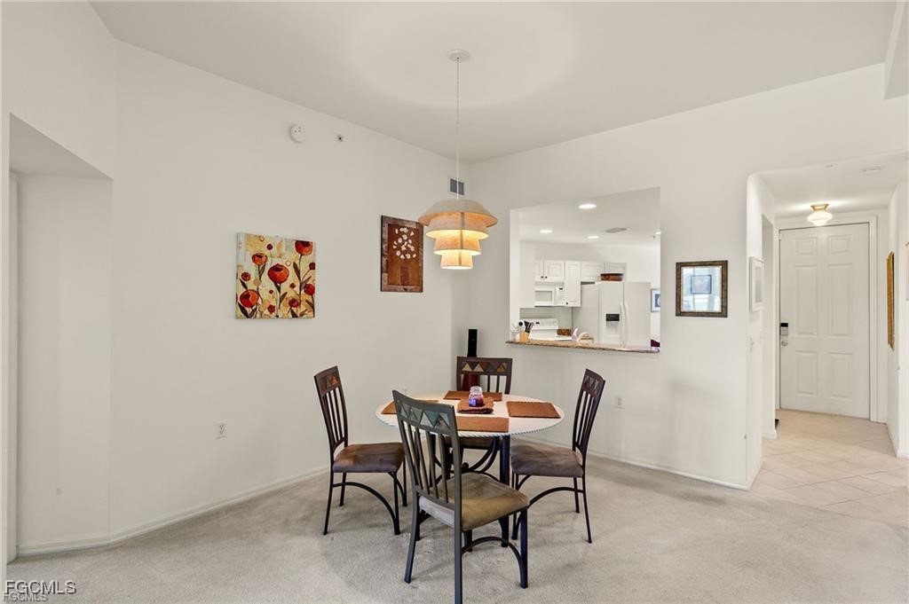 12120 Summergate Circle, Unit 103 Fort Myers, FL 33913 - Photo 10 of 26 a view of a dining room with furniture