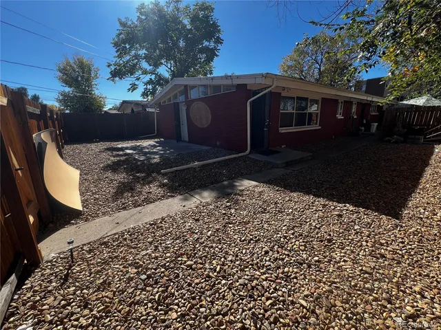 a backyard of a house with a yard