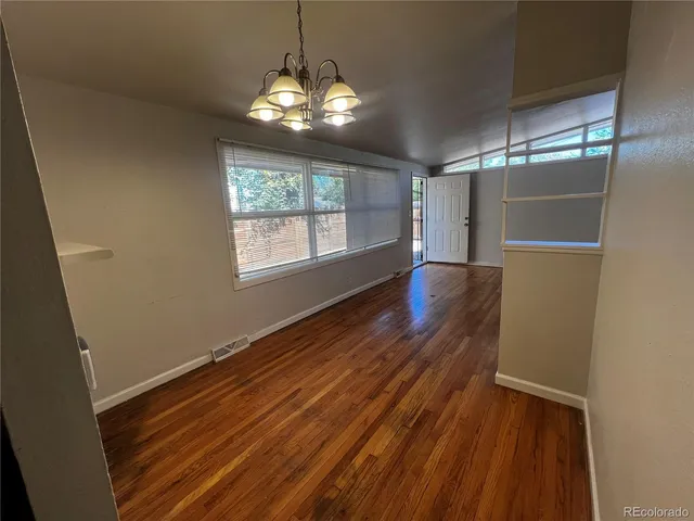a view of wooden floor and brick walls