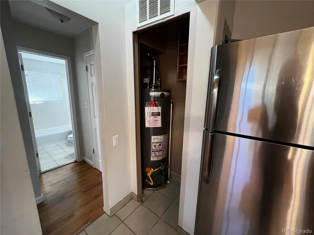 a view of a refrigerator and wooden floor