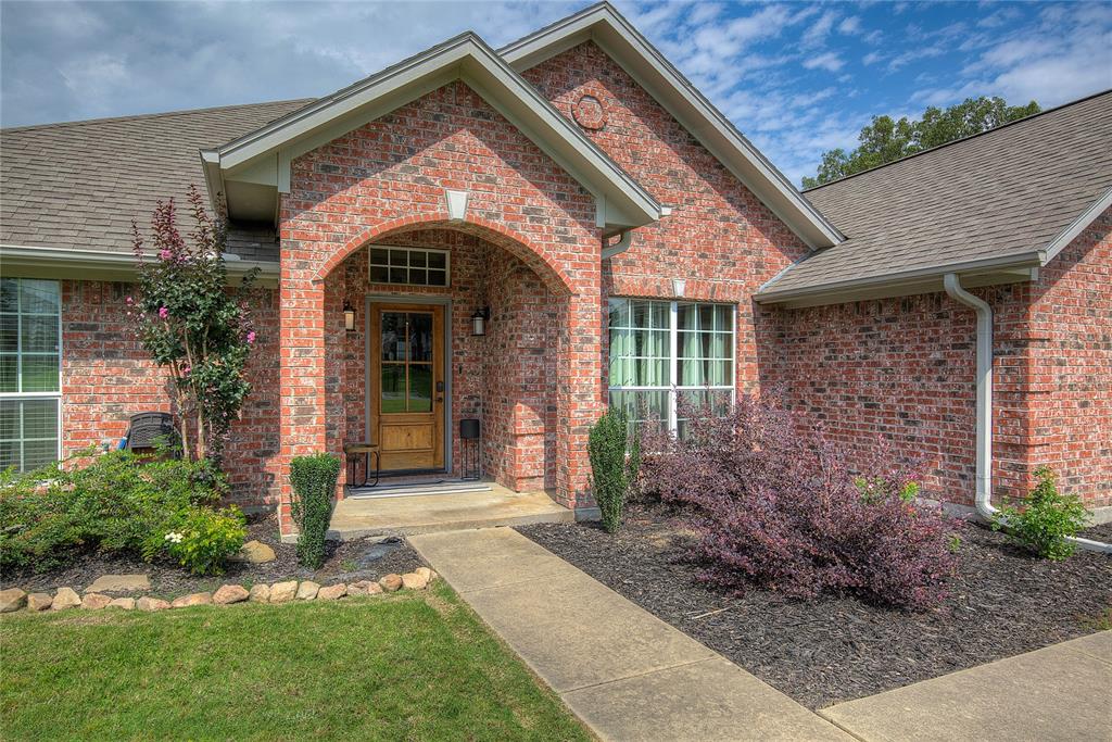 2027 Park Springs Road Sulphur Springs, TX 75482 - Photo 2 of 39 a front view of a house with garden