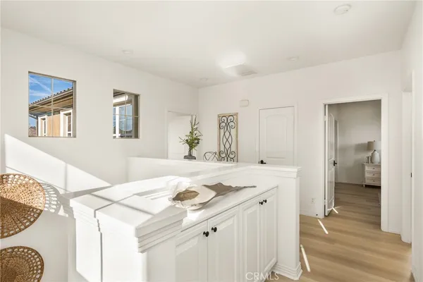 a bedroom with a bed and a potted plant