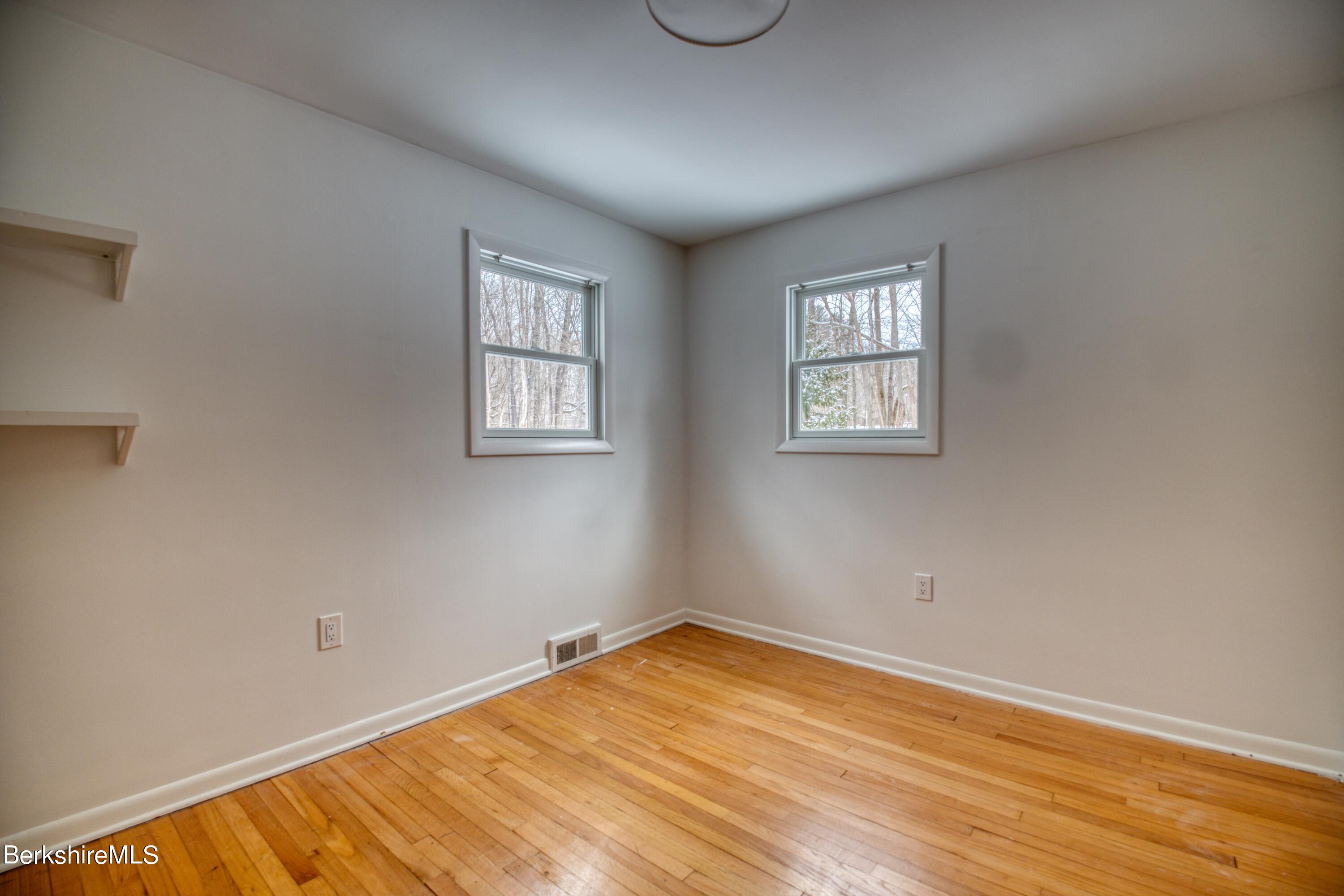 2500 State Road Richmond, MA 01254 - Photo 13 of 35 a view of an empty room with wooden floor and a window