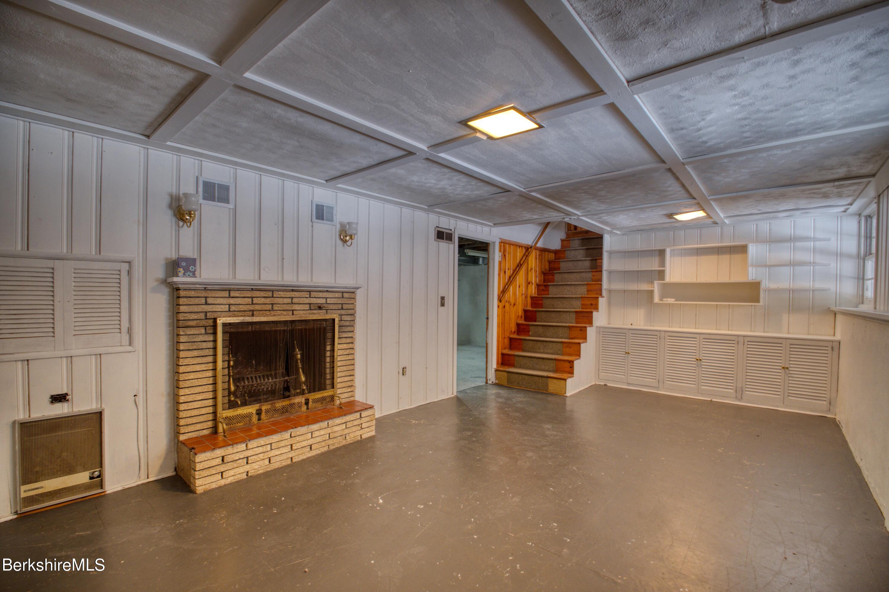 2500 State Road Richmond, MA 01254 - Photo 18 of 35 a view of an empty room with a fireplace and a window
