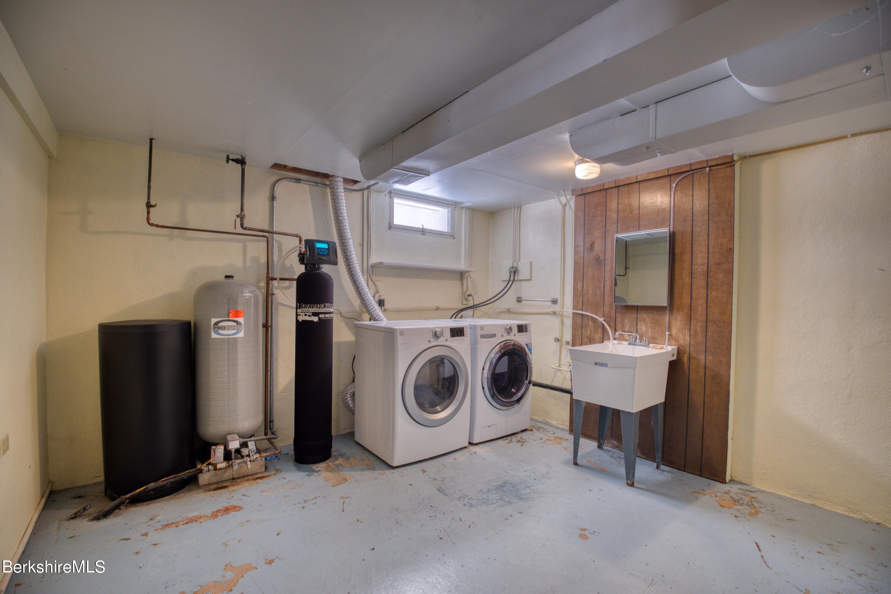 2500 State Road Richmond, MA 01254 - Photo 22 of 35 a utility room with dryer washer and a view of living room