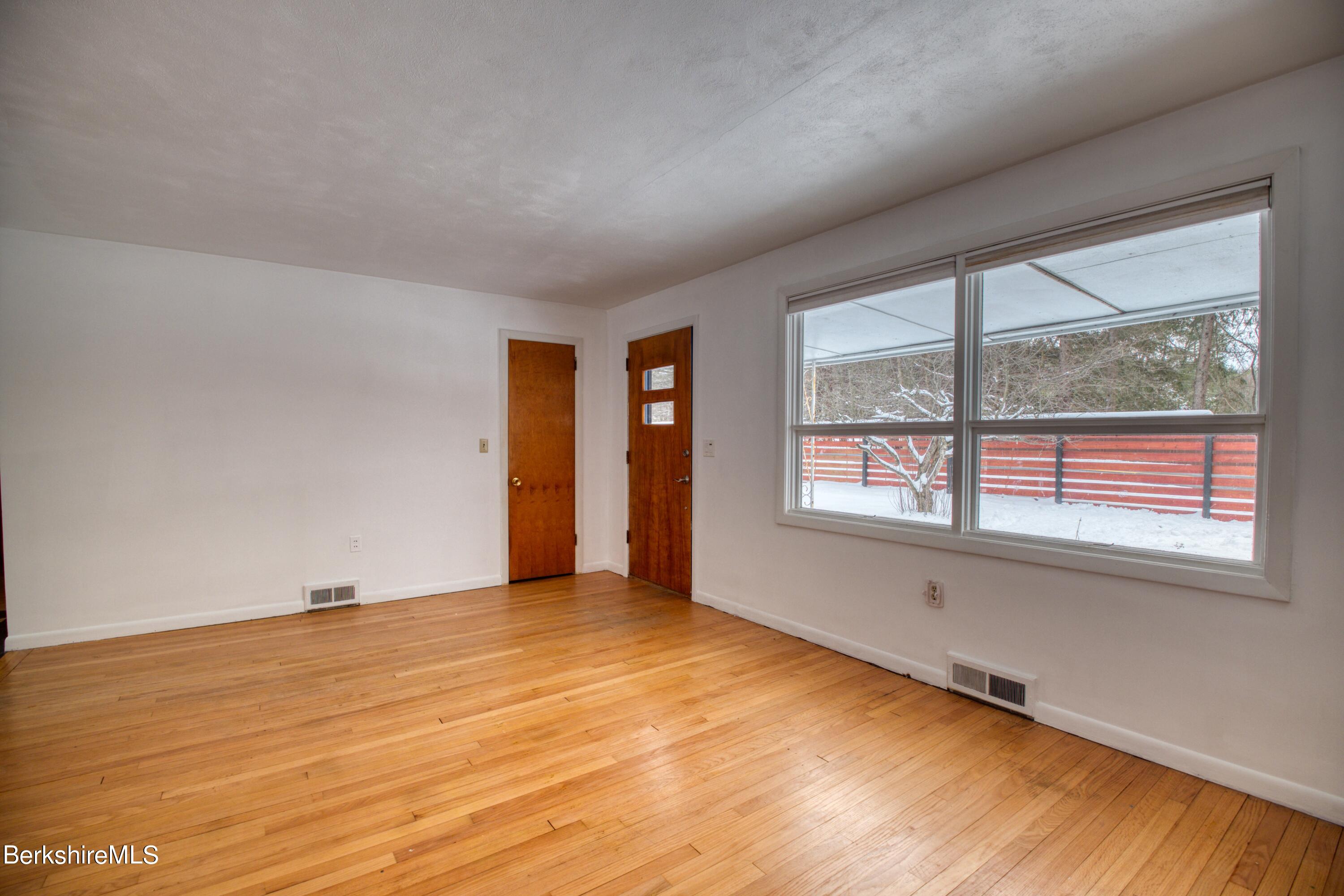 2500 State Road Richmond, MA 01254 - Photo 4 of 35 wooden floor in an empty room with a window