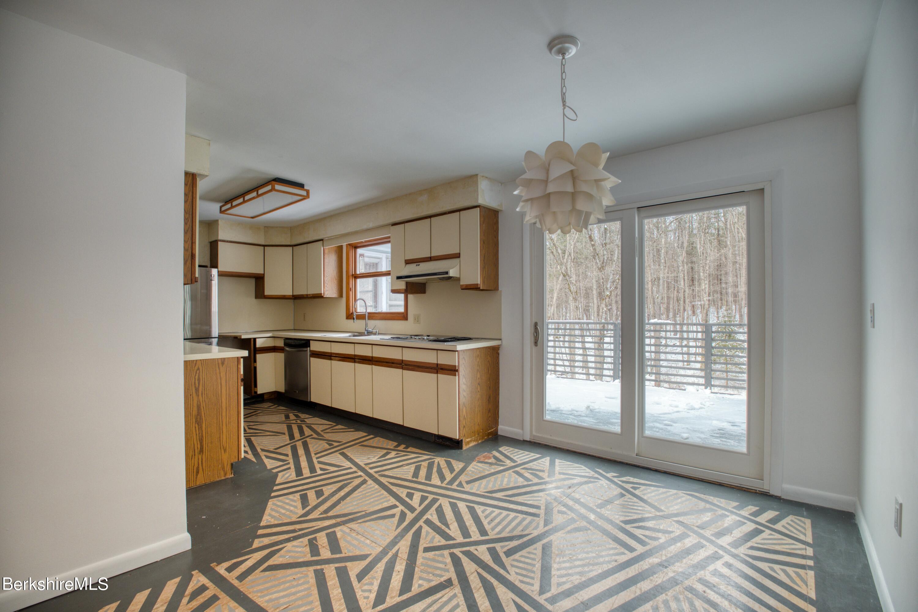 2500 State Road Richmond, MA 01254 - Photo 6 of 35 a kitchen with stainless steel appliances granite countertop a stove and a refrigerator