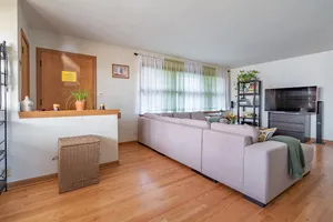 a living room with furniture and a flat screen tv