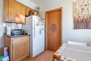 a bathroom with a granite countertop sink a toilet a mirror and shower