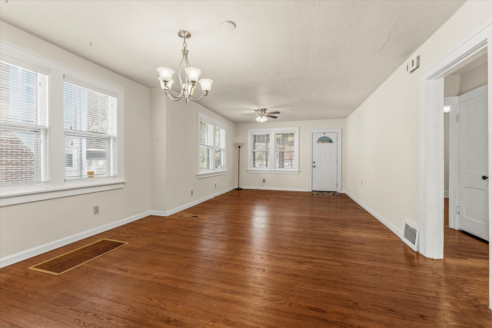 707 South Pine Street Champaign, IL 61820 - Photo 11 of 32 a view of empty room with wooden floor and fan
