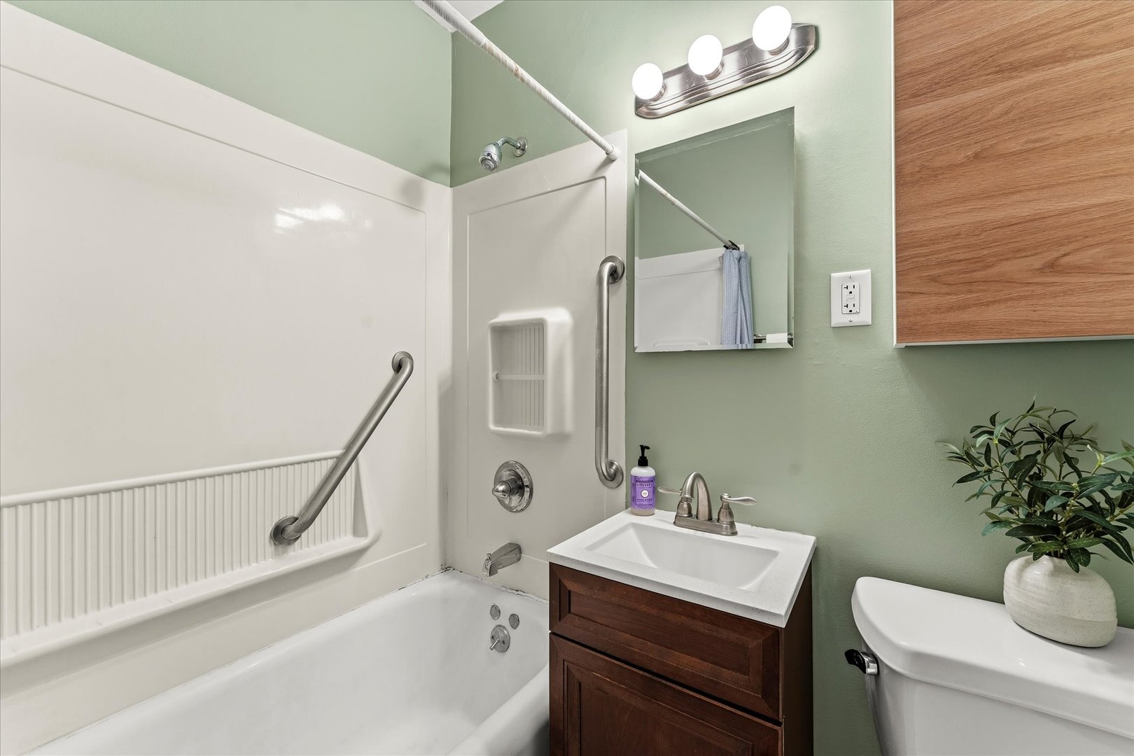 707 South Pine Street Champaign, IL 61820 - Photo 20 of 32 a bathroom with a sink vanity mirror and toilet
