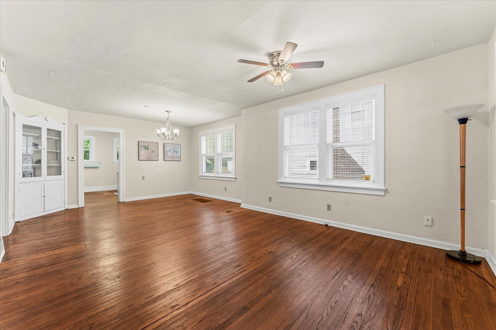 707 South Pine Street Champaign, IL 61820 - Photo 8 of 32 a view of empty room with wooden floor and fan