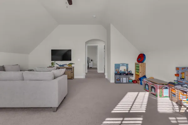 a living room with furniture and a window