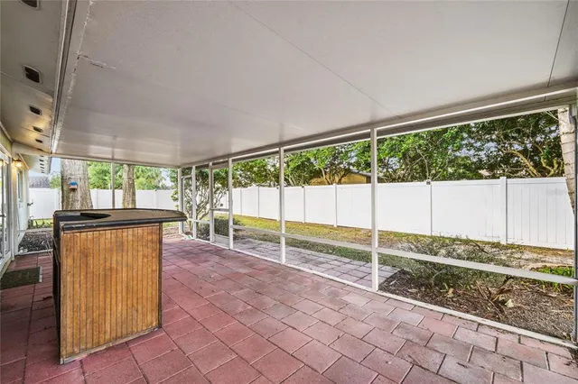 a view of a room with wooden floor and fence