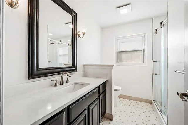 a bathroom with a sink a vanity and a mirror