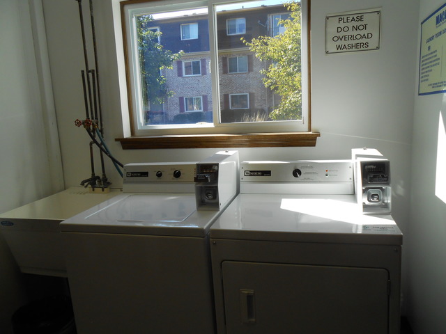 892 South Plum Grove Road, Unit 103 Palatine, IL 60067 - Photo 13 of 14 a view of a kitchen that has a sink and a window