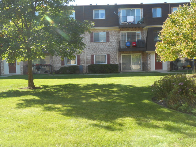 892 South Plum Grove Road, Unit 103 Palatine, IL 60067 - Photo 14 of 14 a view of a building with a swimming pool