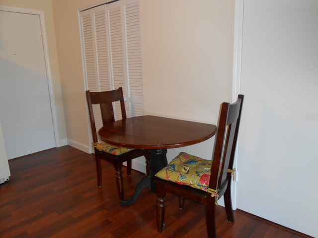 892 South Plum Grove Road, Unit 103 Palatine, IL 60067 - Photo 6 of 14 a view of a dining room with furniture and wooden floor
