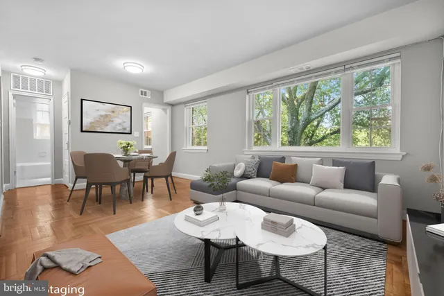 a living room with furniture and a large window