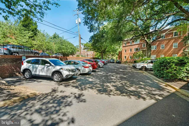 a view of a cars parked in front of a house