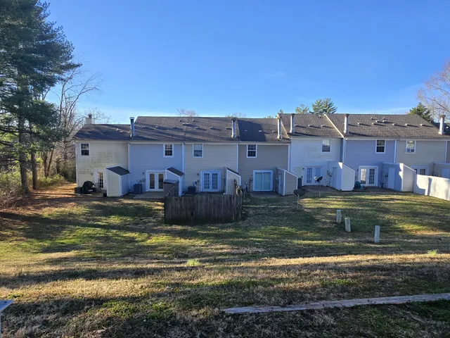 a view of a big house with a big yard