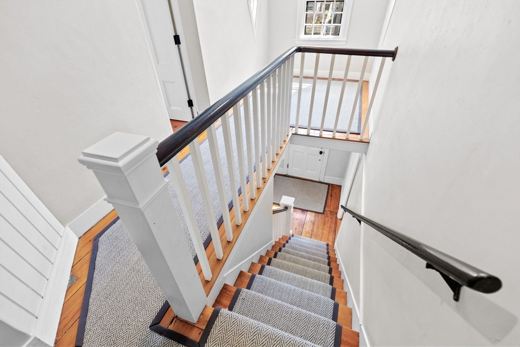 132 Main Street Hingham, MA 02043 - Photo 18 of 42 a view of staircase with railing and white walls