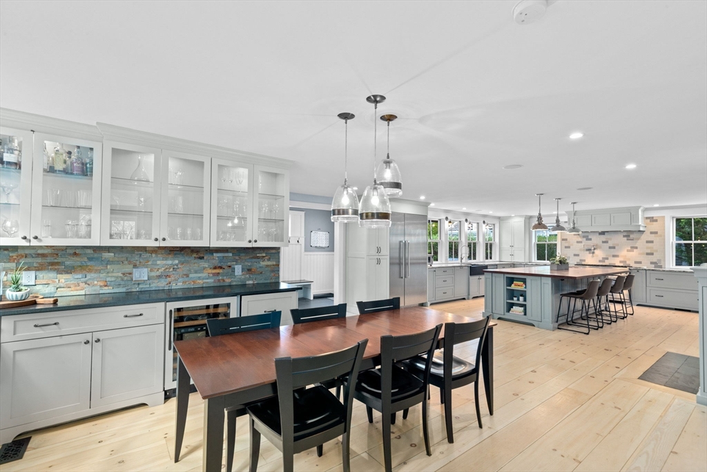 132 Main Street Hingham, MA 02043 - Photo 2 of 42 a kitchen with a dining table chairs and wooden floor