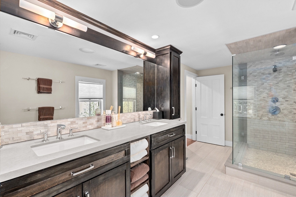 132 Main Street Hingham, MA 02043 - Photo 21 of 42 a bathroom with a granite countertop sink mirror and double