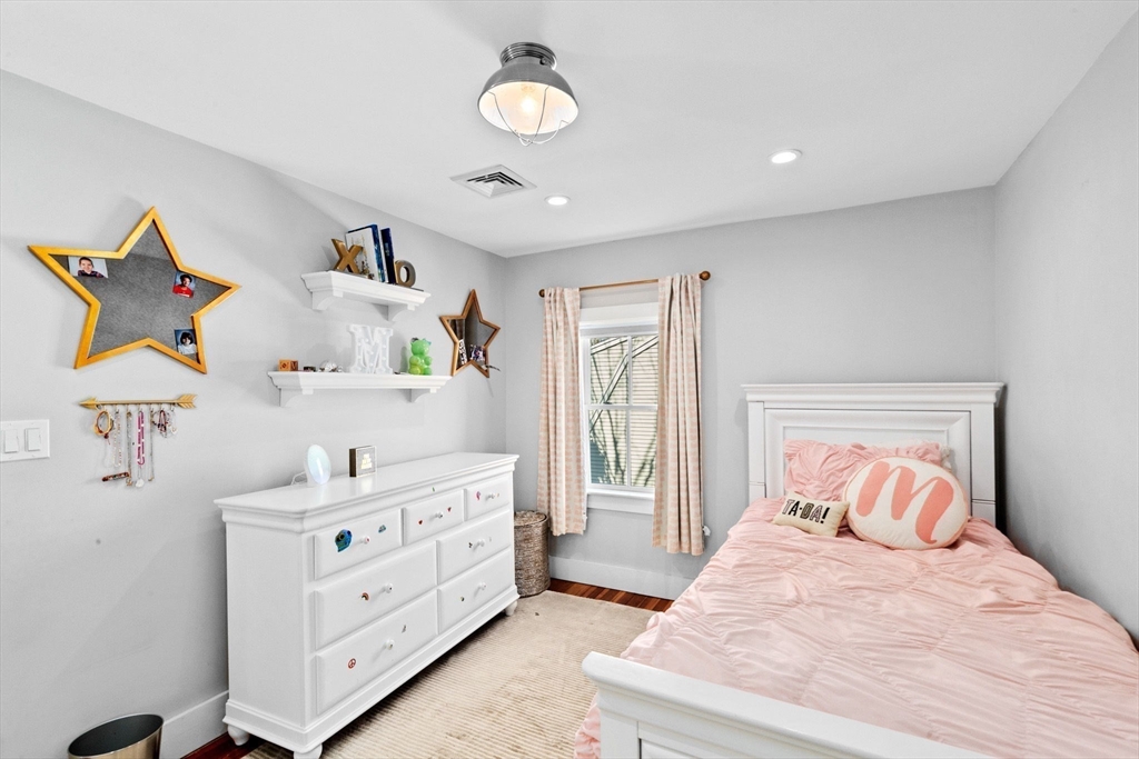 132 Main Street Hingham, MA 02043 - Photo 27 of 42 a bedroom with a bed and a window