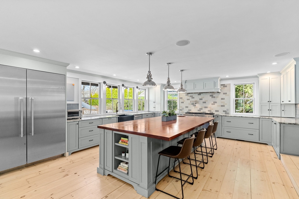 132 Main Street Hingham, MA 02043 - Photo 3 of 42 a kitchen with stainless steel appliances granite countertop a sink a stove and refrigerator